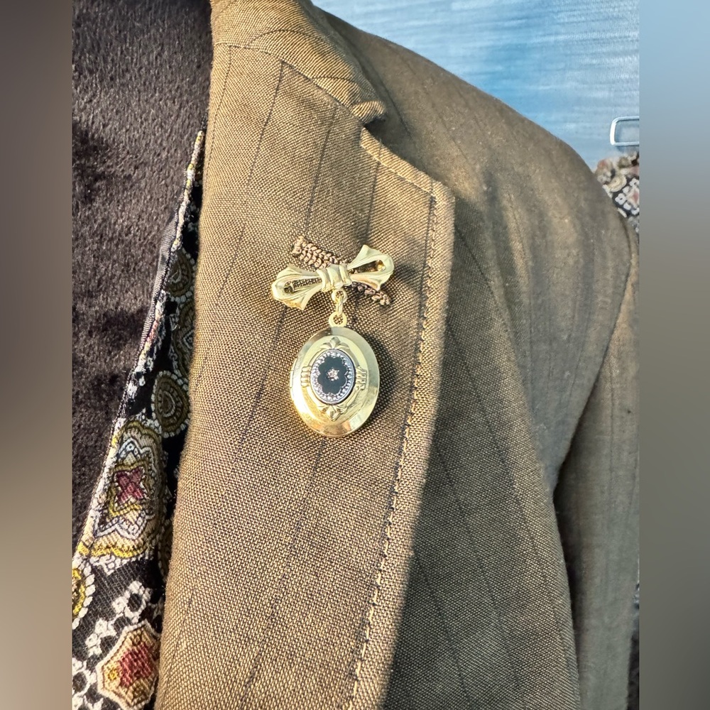 Elegant Gold and Black Brooch